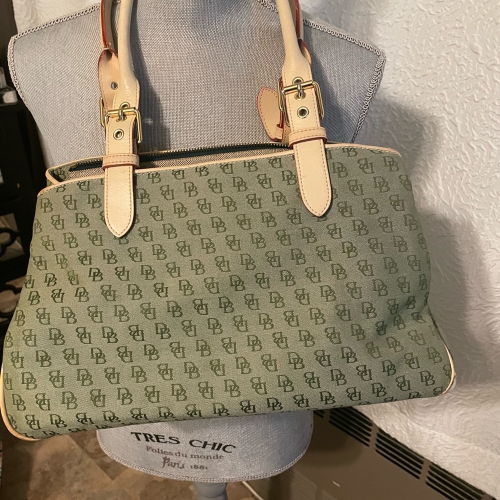 Dooney & Bourke beige and green insignia hand bag . Like new